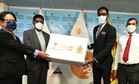 The UNFPA Representative and Japanese Ambassador hand over a box of essential medication & commodities to the Minister of Health